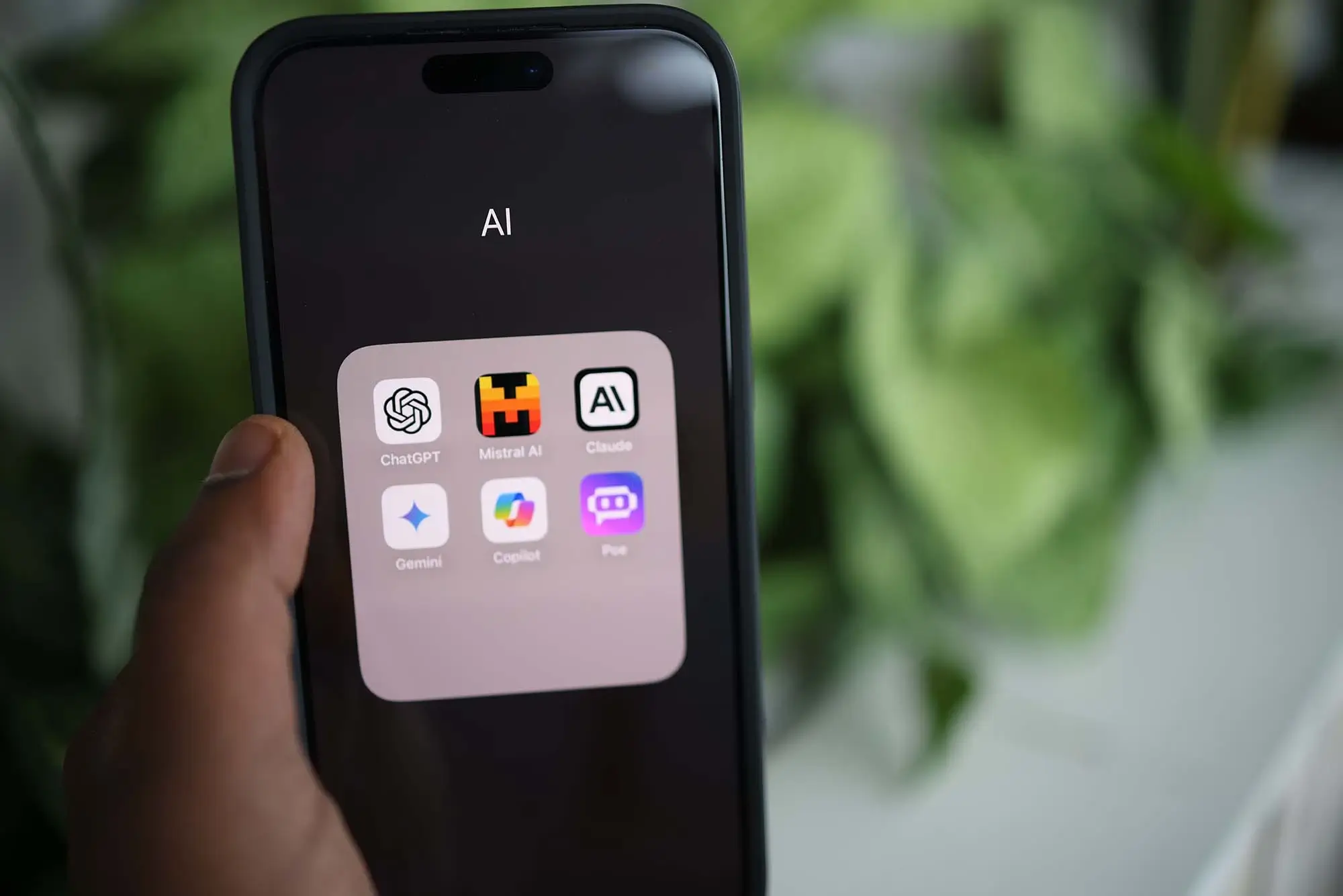 Smartphone displaying artificial intelligence applications for digital search and marketing