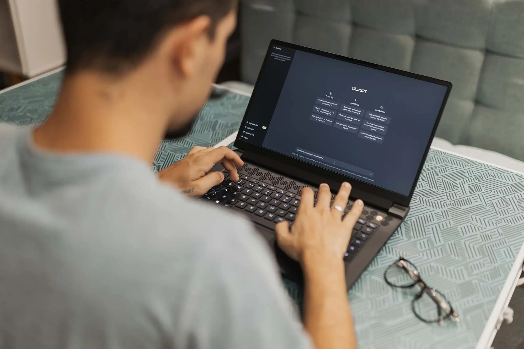 Person using a laptop displaying AI-related content for business search optimization