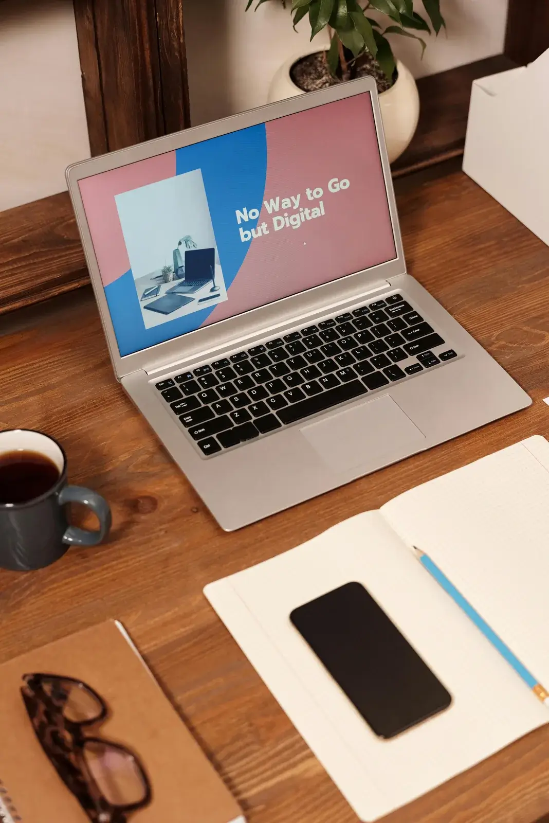 Laptop on a desk with digital marketing strategy on screen